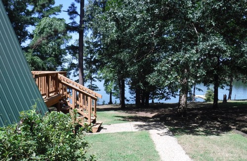 Avinger Cabin | Waterfront Home with Pier Lake O' the Pines - Acorn Timbers