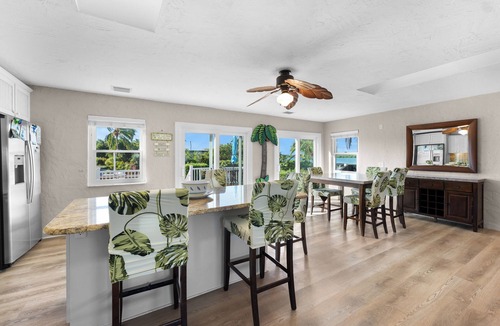 Cudjoe Gardens House | Waterfront home with a large dock, pool, and deck area. Can accommodate pets.
