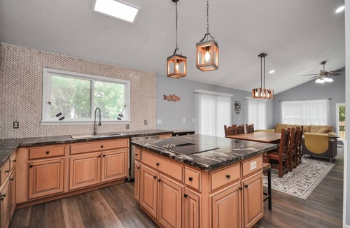 Montgomery House | Waterfront house with a large deck and dock for boat or fishing