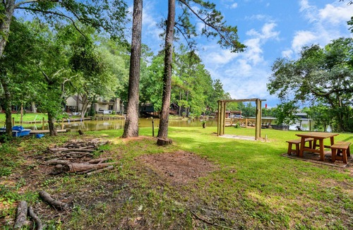 Montgomery House | Waterfront house with a large deck and dock for boat or fishing