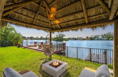 Ojus House | Waterfront Jungle House Firepit Sunset and more