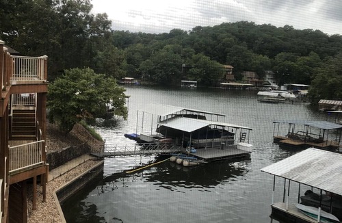 Lake of the Ozarks Cabin | Waterfront lake home, dock, quiet swim cove next to The Cave Restaurant + many