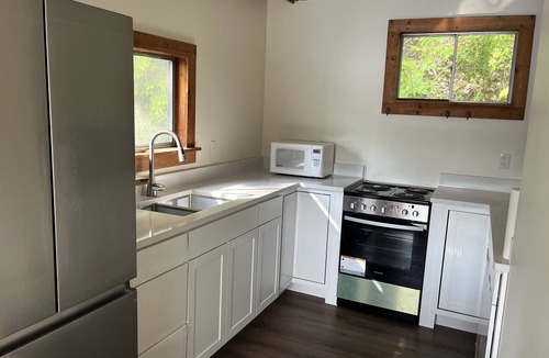 Colton House | Waterfront Location. Panoramic Views. Cozy Comforts. Treehouse Tranquility.