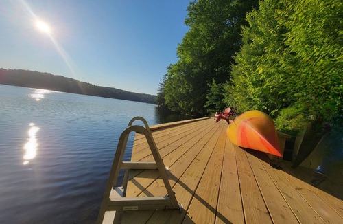 Colton House | Waterfront Location. Panoramic Views. Cozy Comforts. Treehouse Tranquility.