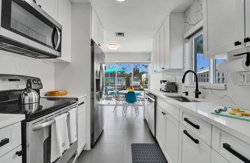 Citrus Isles House | Waterfront luxury pool home near FLL Airport.