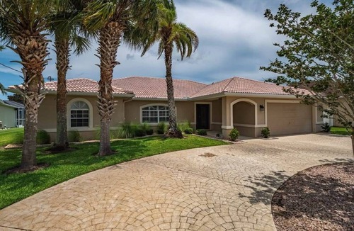 Palm Harbor House | Waterfront Luxury: Pool, Spa, Dock & Coastal Style