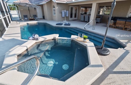 Palm Harbor House | Waterfront Luxury: Pool, Spa, Dock & Coastal Style