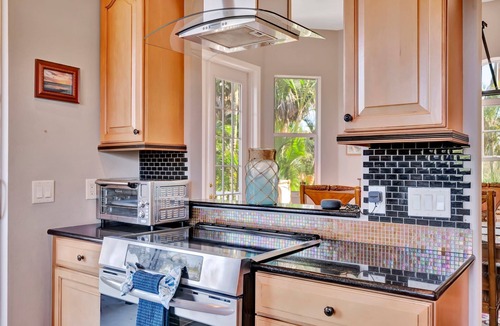 Palmetto House | Waterfront Mansion & Elevator 4 Balconies, Hot Tub