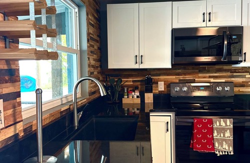 Lake Panasoffkee House | Waterfront Oasis, private dock, cozy fire pit, jacuzzi, stunning views & more