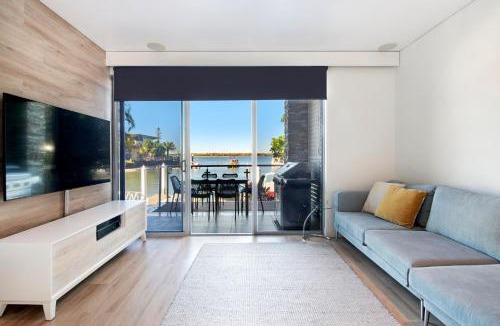 Runaway Bay Apartment | Waterfront Oasis in Runaway Bay - CoastHM