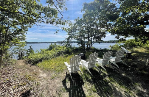 Waquoit Village Cottage | Waterfront on Waquoit Bay. 2.5 acre private. Sunsets, swim, kayaks, fish.