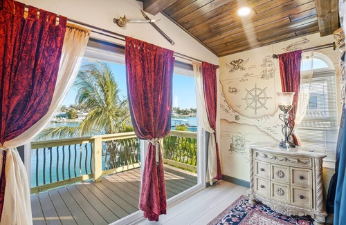 Indian Rocks Beach House | Waterfront Pirate House with Pool & 2 Golf Carts