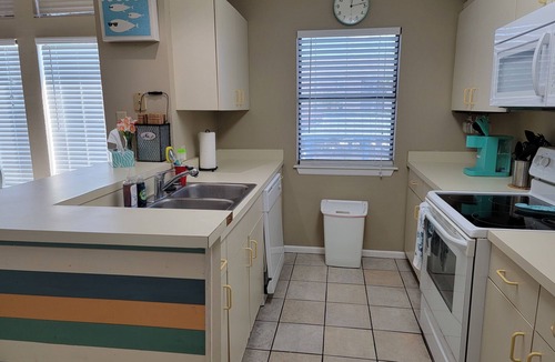 Corpus Christi Condo | Waterfront Paradise has a Reserved Boat Slip, Overlooks the Pool & the Canal