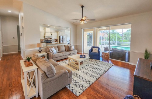 Palm Harbor House | Waterfront Pool Home | Dock | Game Room | King Bed