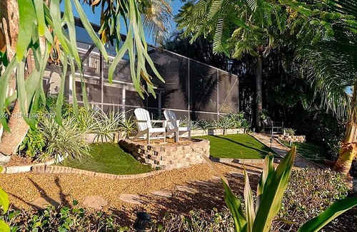 Palm City House | Waterfront Pool HotTub Kayaks Firepit