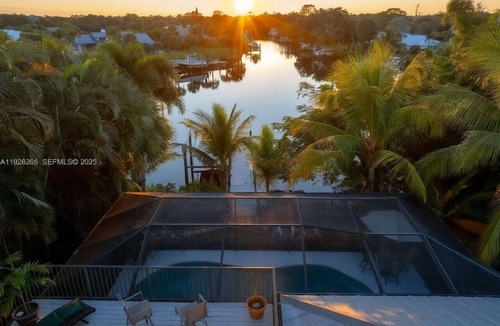 Palm City House | Waterfront Pool HotTub Kayaks Firepit