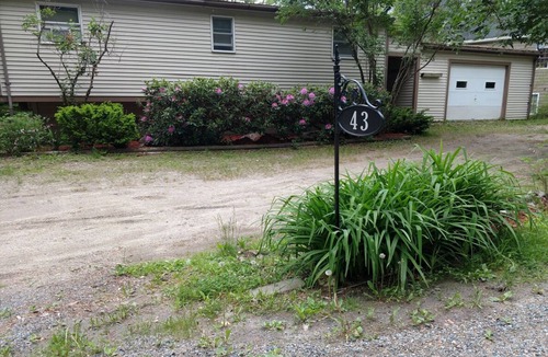 Sunapee House | Waterfront property on pond with private dock .