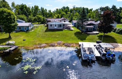 Reed City House | Waterfront Retreat w/Dock & Yard in Reed City!
