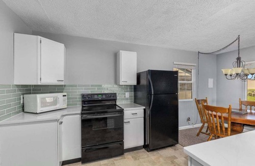 Newaygo Cottage | Waterfront Suite Dock, Kayaks, Firepit, BBQ