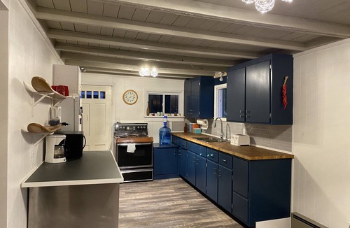 Wolfe Island Cottage | Waterfront, sunlit cozy cottage with large dock, fire pit and good swimming.