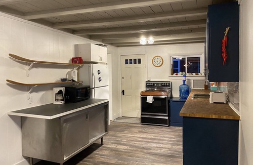 Wolfe Island Cottage | Waterfront, sunlit cozy cottage with large dock, fire pit and good swimming.
