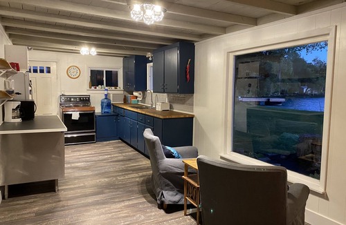 Wolfe Island Cottage | Waterfront, sunlit cozy cottage with large dock, fire pit and good swimming.
