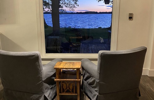 Wolfe Island Cottage | Waterfront, sunlit cozy cottage with large dock, fire pit and good swimming.