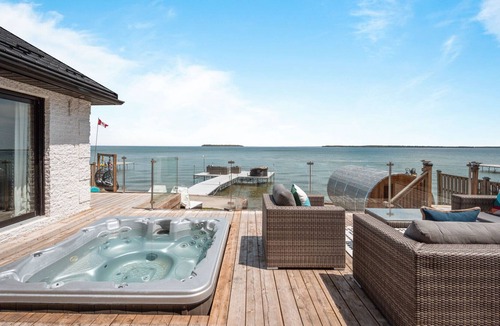 Alcona Cottage | Waterfront Wow with hot tub