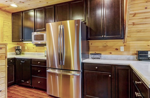 Wright City Ski Chalet | Waterside Cottage by Sarah Bernard with Firepit, Private Dock, and Hot Tub