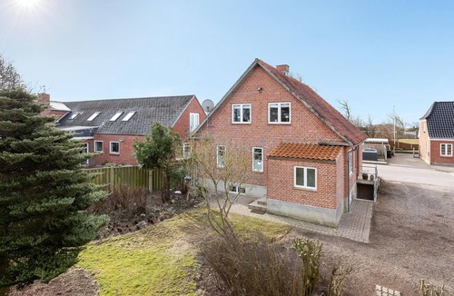 Tim House | Welcome to this attractive vacation home with beautiful outdoor areas.