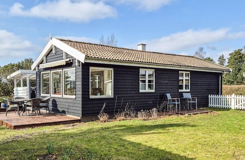 Skibby House | Welcome to this cozy wooden holiday home for a wonderful vacation.