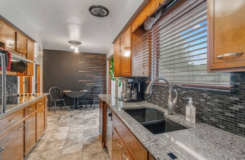 Waterloo House | Welcoming 2-bedroom home with large deck and central location.