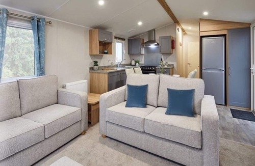 Dunbar House | Well appointed caravan with patio doors and decking.