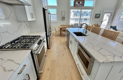 Sea Isle City House | Well Crafted Townhouse featuring 6 bedrooms, 4.5 bathrooms, a Bonus room and a Heated Pool.