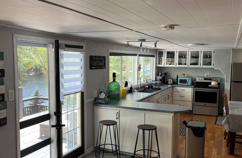 St. Charles Cottage | West Arm cottage with panoramic views, boathouse