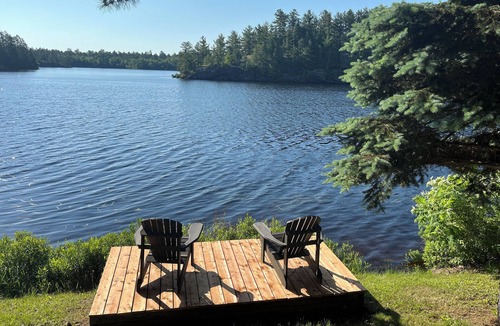 St. Charles Cottage | West Arm cottage with panoramic views, boathouse