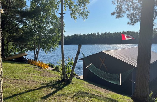 St. Charles Cottage | West Arm cottage with panoramic views, boathouse