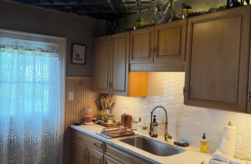 Fort Dodge House | Whimsical cottage next to beautiful park setting