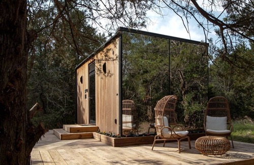 Bastrop Cabin | Whimsical Flower-Inspired Mirror Cabin by the Lake in the Enchanted Forests of Texas