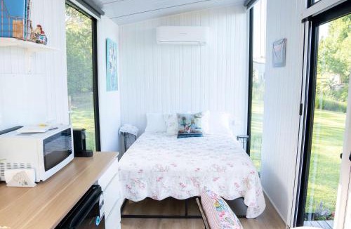 Maleny House | White Jacaranda Tiny House by Tiny Away