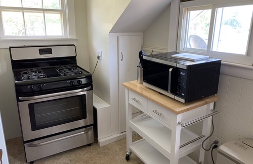 Winnisquam House | Winnisquam Lakeside Funky Ski Chalet w-Sandy Beach & Boat Docks