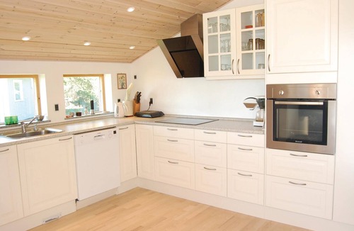 Bog By House | With a view of Bogø and Grønsund lies this beautiful cottage.