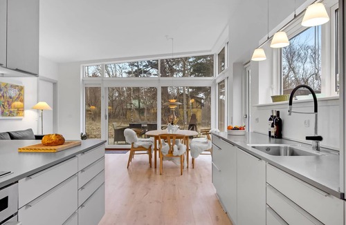 Udsholt Sand House | Wonderful, modern home on wooded lot right on the water.