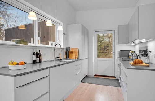 Udsholt Sand House | Wonderful, modern home on wooded lot right on the water.