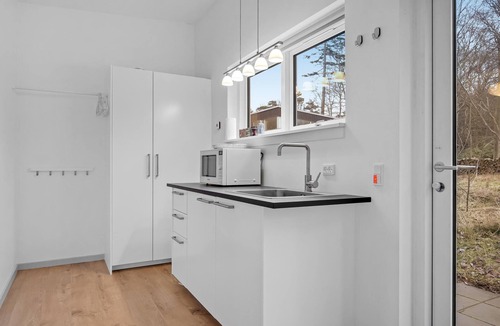 Udsholt Sand House | Wonderful, modern home on wooded lot right on the water.