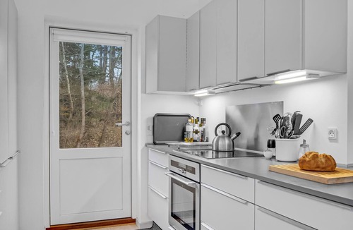 Udsholt Sand House | Wonderful, modern home on wooded lot right on the water.