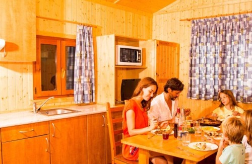 Santa Susanna Ski Chalet | Wooden chalet with air conditioning and a covered terrace
