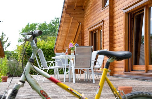 Baudement Ski Chalet | Wooden House in a green setting.