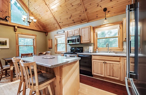South Pond Shores Ski Chalet | Woodroad Chalet- Ski house close to water, Hot tub, large lot