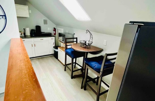 Historic Hill Condo | Wrap around deck with sunset view